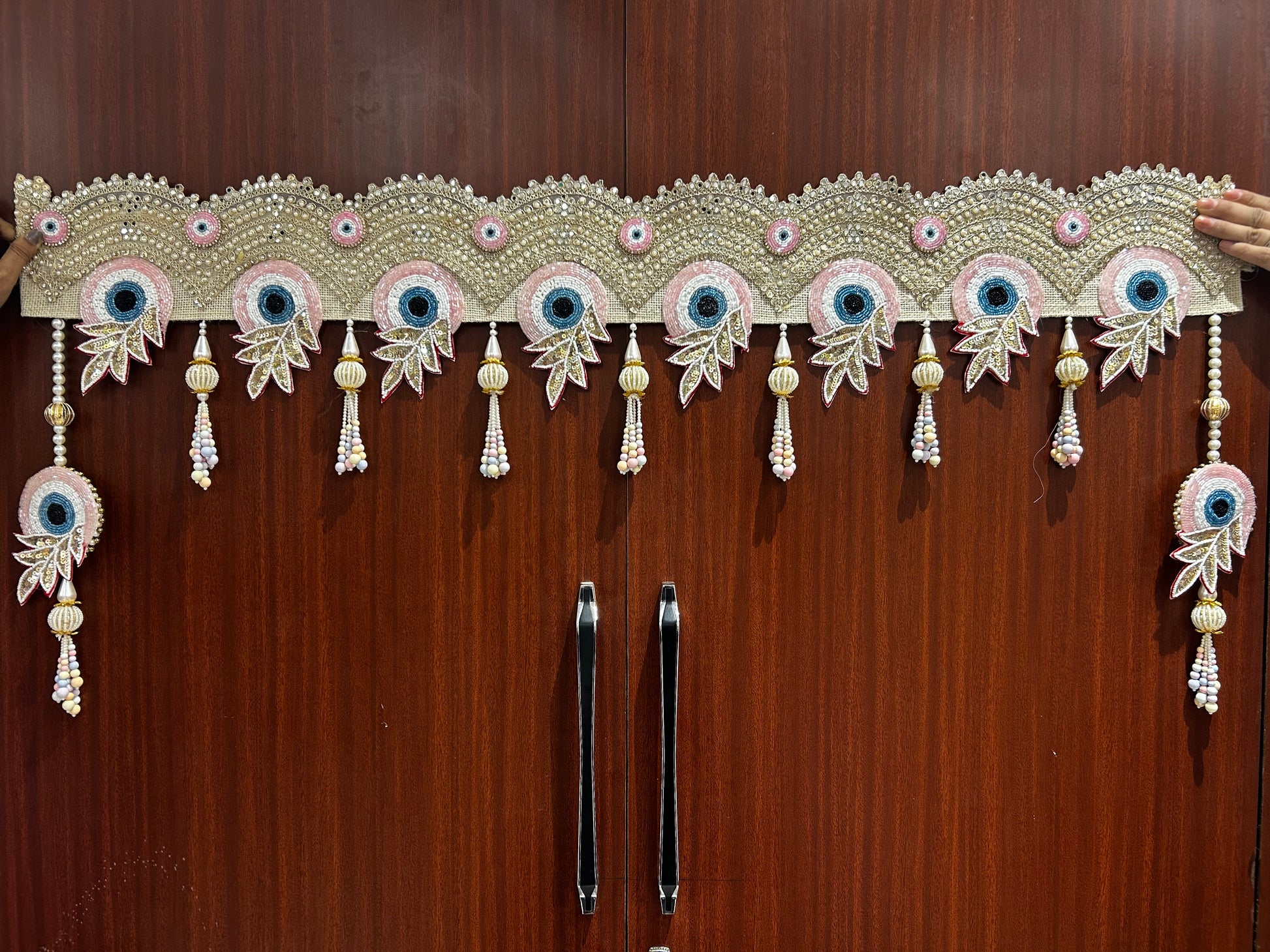 Handmade peacock evil eye bandhanwar for main door with pearl tassels and festive door decoration